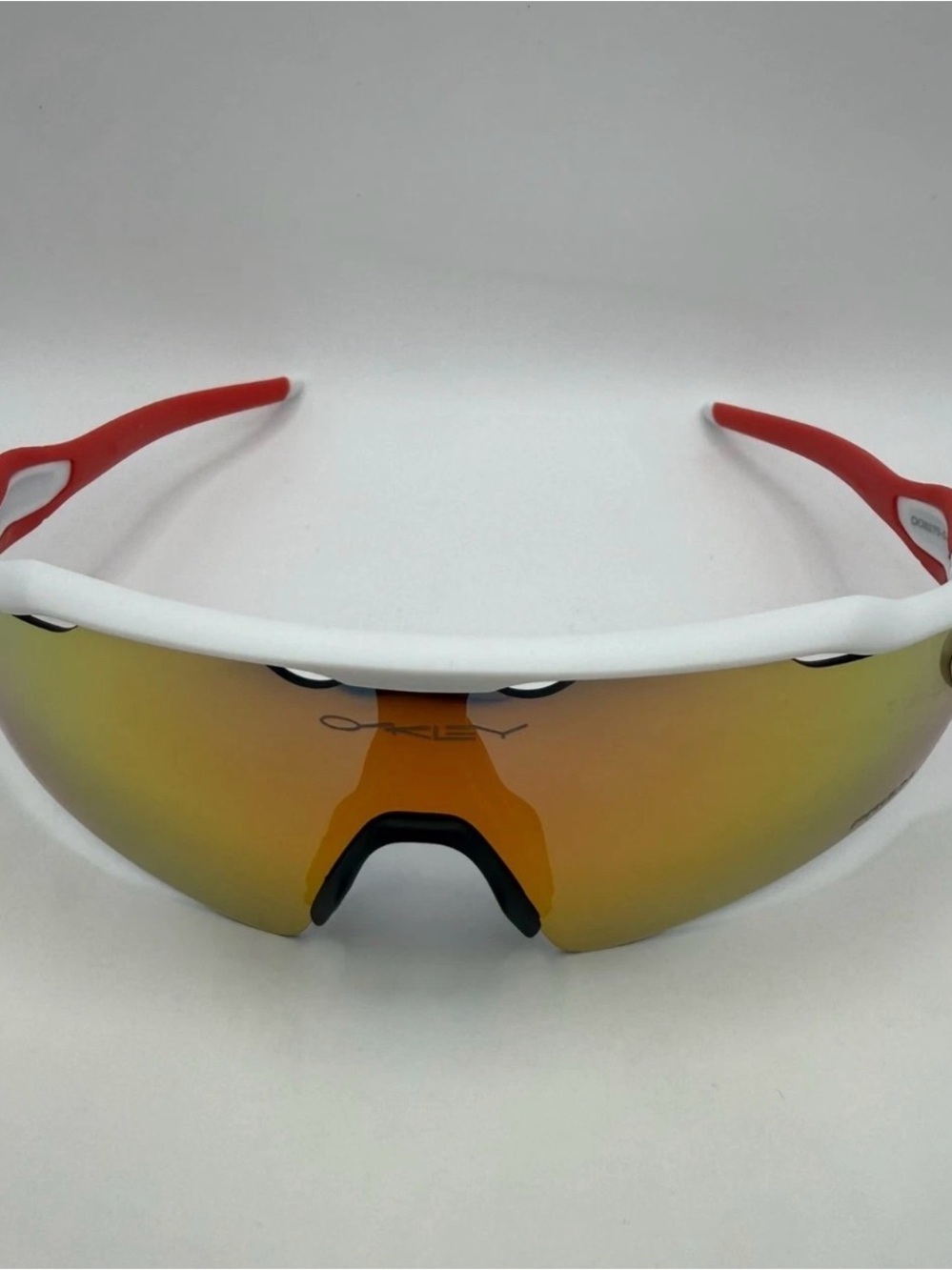 Oakley White Frame Red Temple Sports Sunglasses with Amber Mirrored Lens